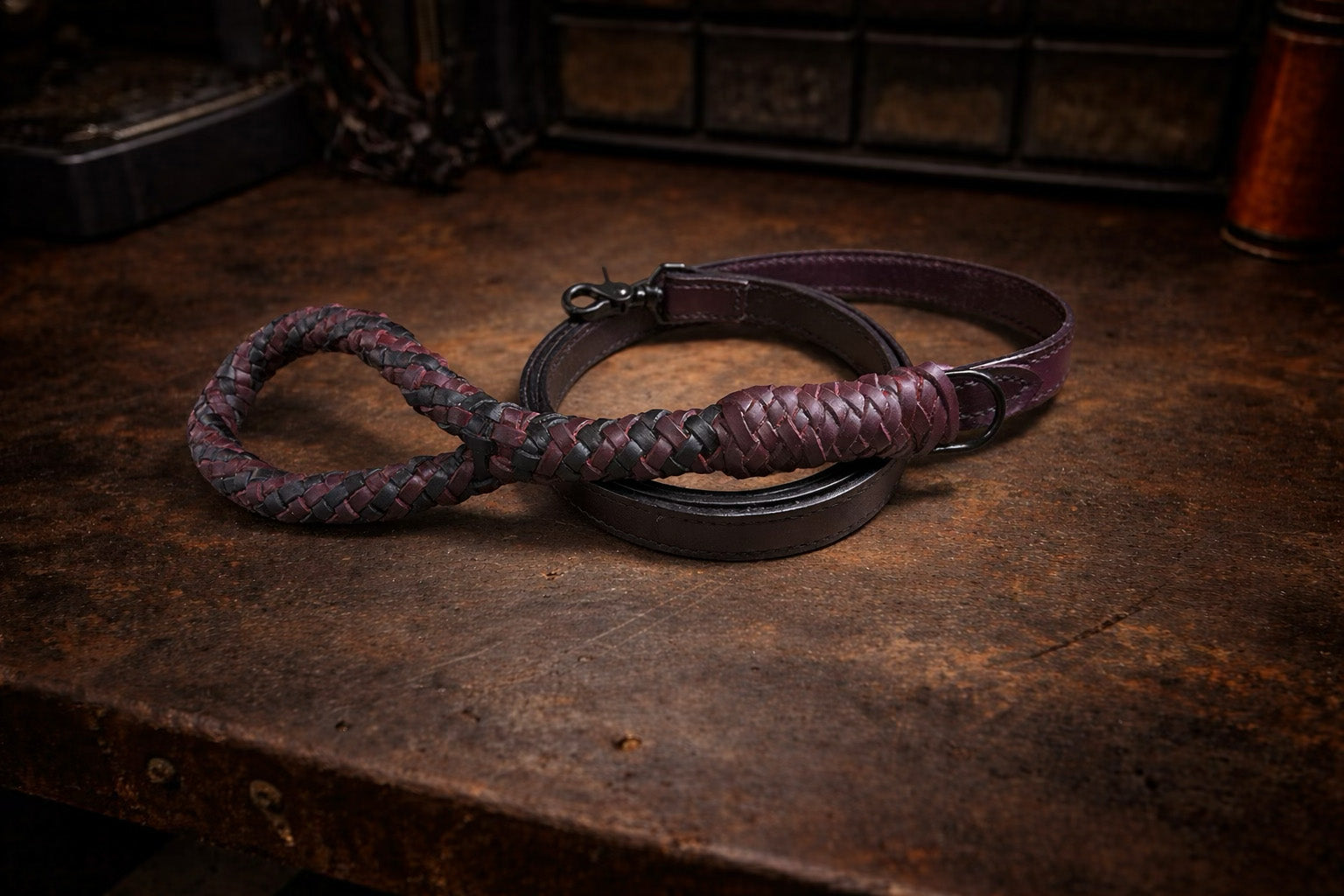 Purple braided dog leash and collar on a dark wooden surface